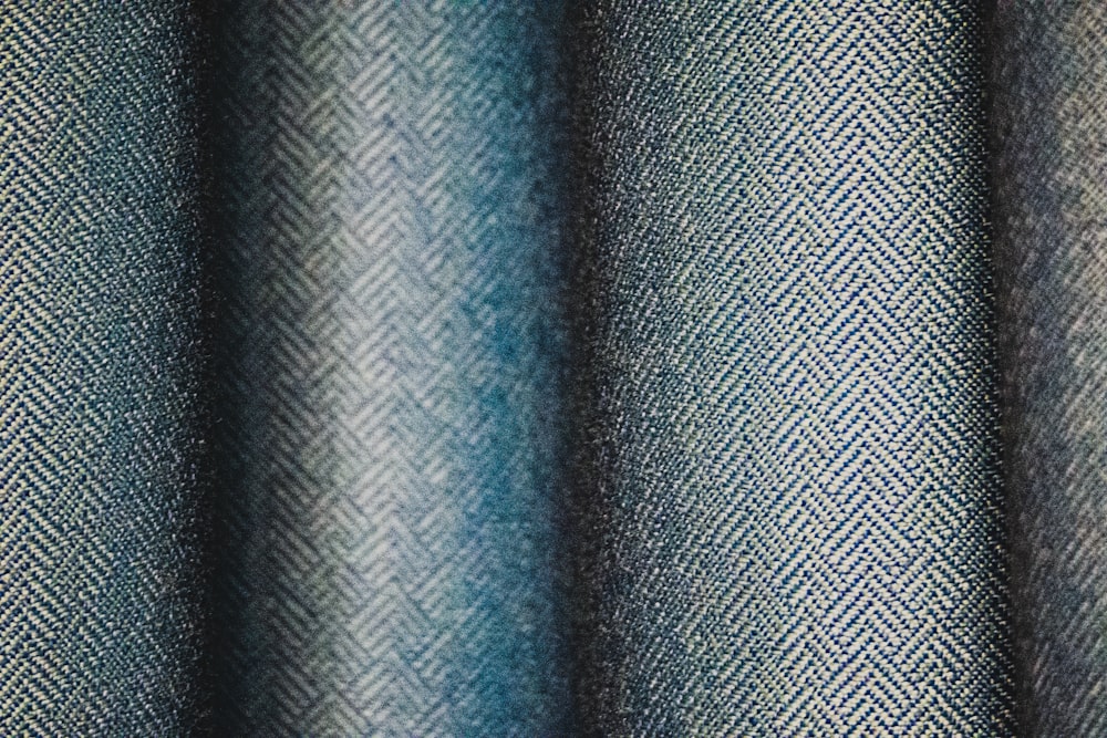 blue and black striped textile