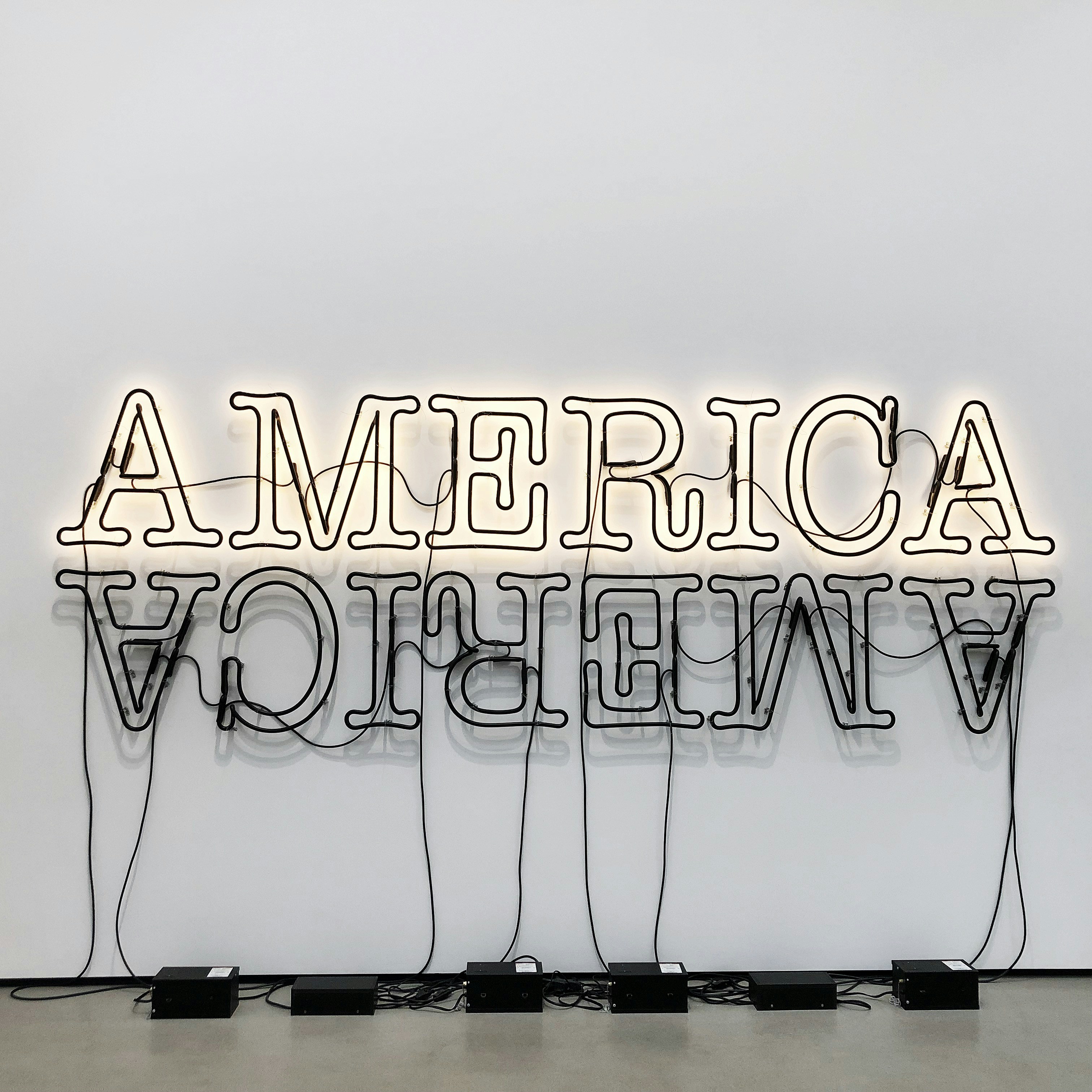 white and black love is love neon light signage