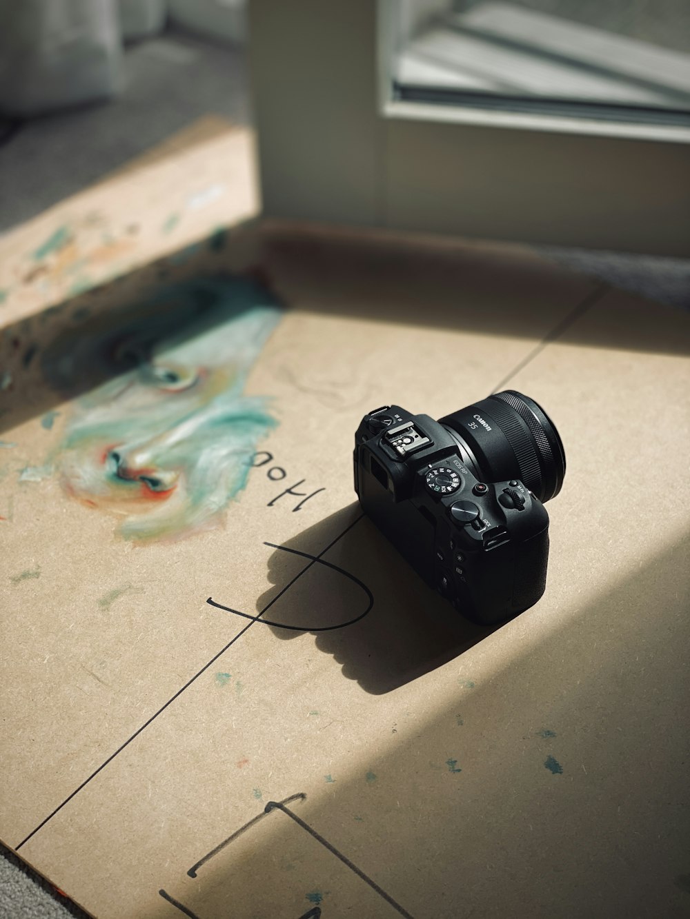 black dslr camera on white table