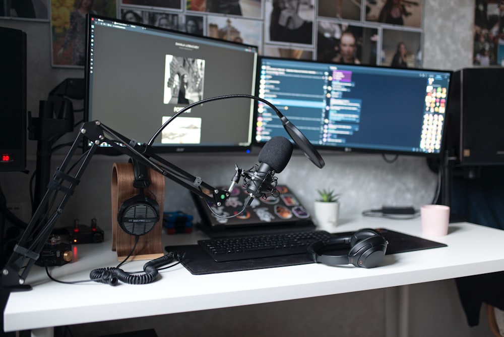 black laptop computer on white table