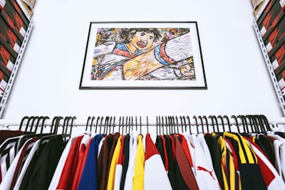 assorted color clothes hanged on clothes hanger
