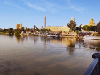 brown concrete building near body of water during daytime