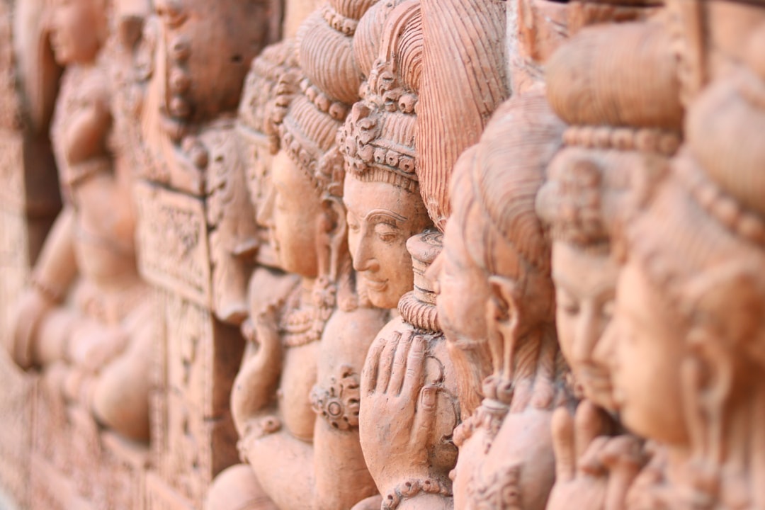 brown concrete statues during daytime