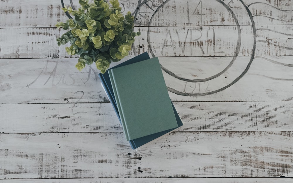 green book on white textile