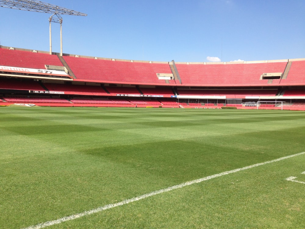 green and red stadium under blue sky during daytime