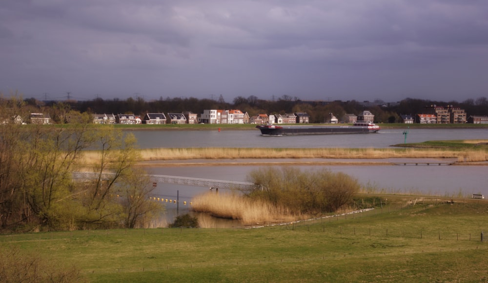 white and black boat on body of water during daytime