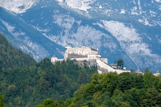 white concrete building on top of mountain during daytime in Salzburg Austria