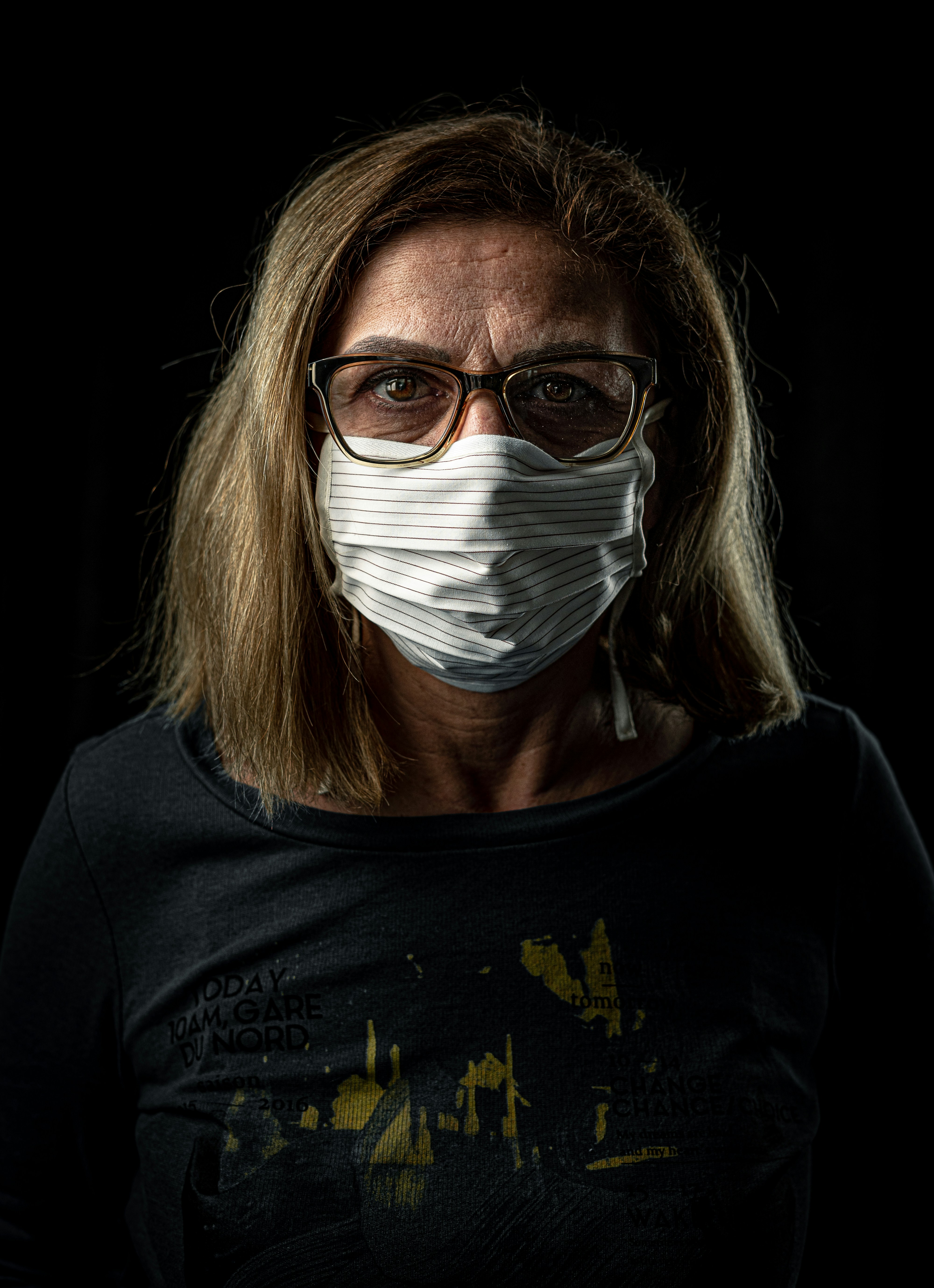 woman in black crew neck shirt with white face mask