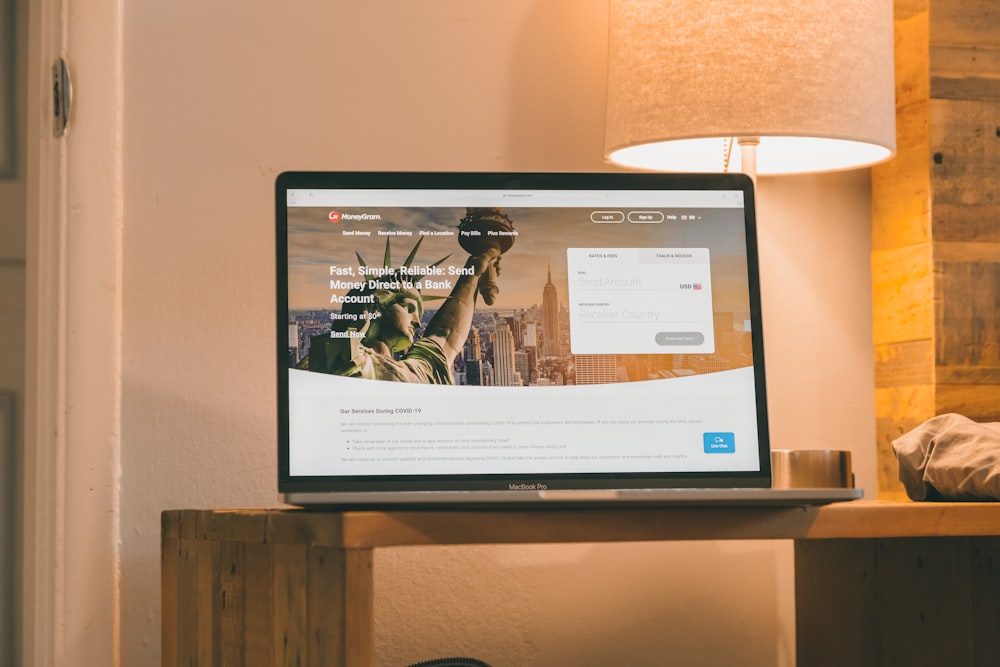 black flat screen computer monitor on brown wooden table