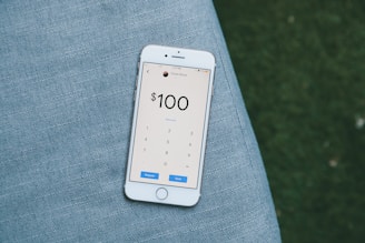 white samsung android smartphone on gray textile