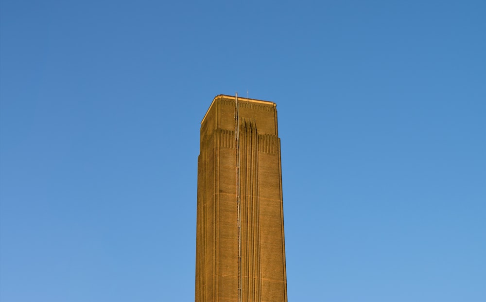 brown concrete building under blue sky during daytime