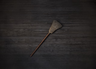 brown and black brush on brown wooden table
