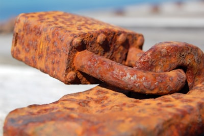brown metal chain on brown concrete brick rust google meet background