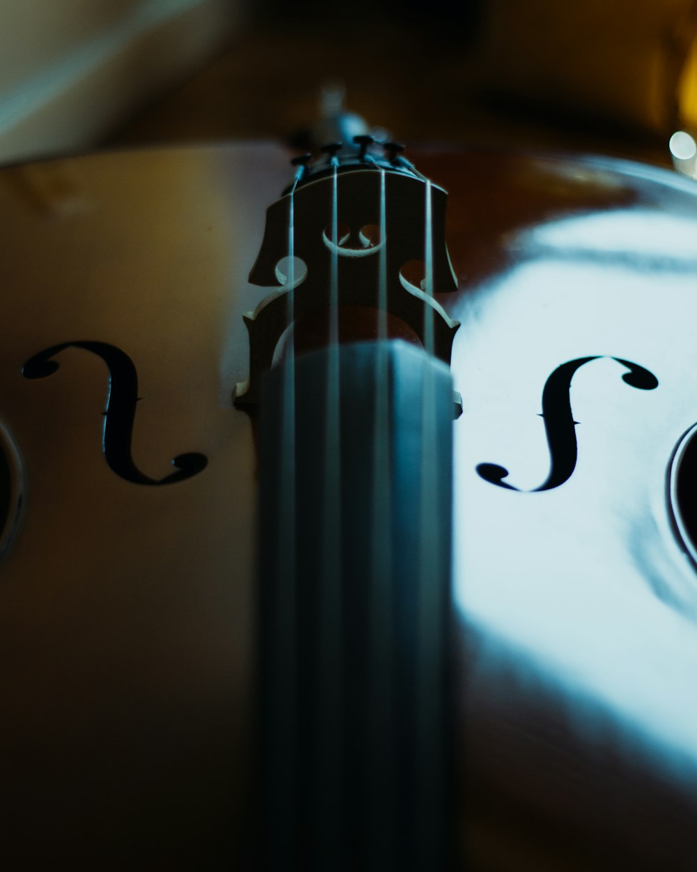 brown violin on white table