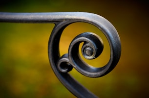 black metal fence in close up photography
