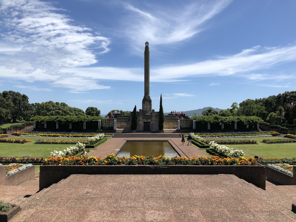 brown concrete statue under blue sky during daytime