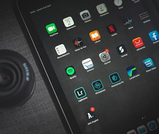 black ipad showing icons with icons