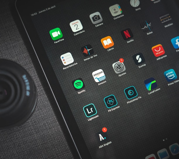 black ipad showing icons with icons