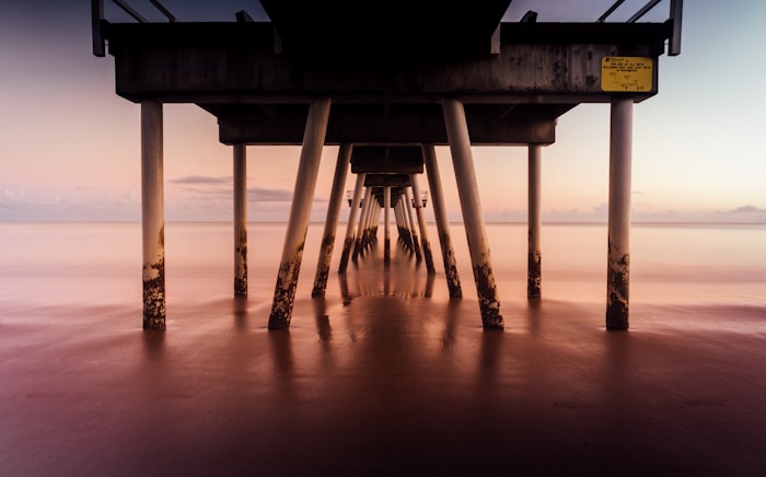 Hervey Bay, silhouette of dock on sea during sunset in Australia