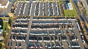 An aerial view of a parking area filled with vehicles.