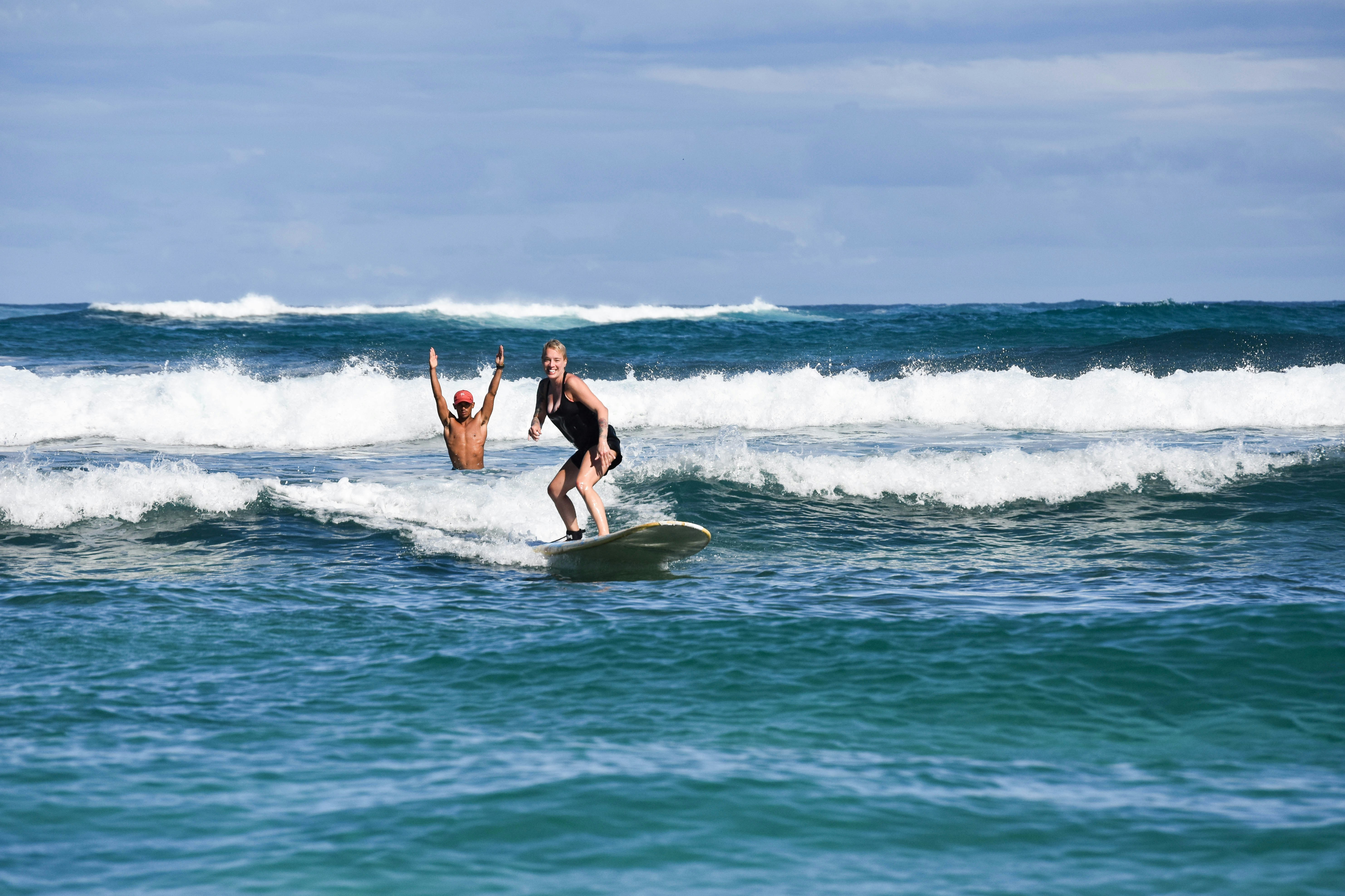 Woman in black bikini surfing on sea waves during daytime photo – Free ...