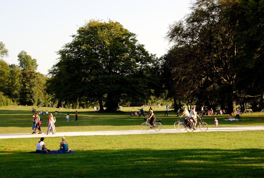 Open public park with visitors walking along green pathways