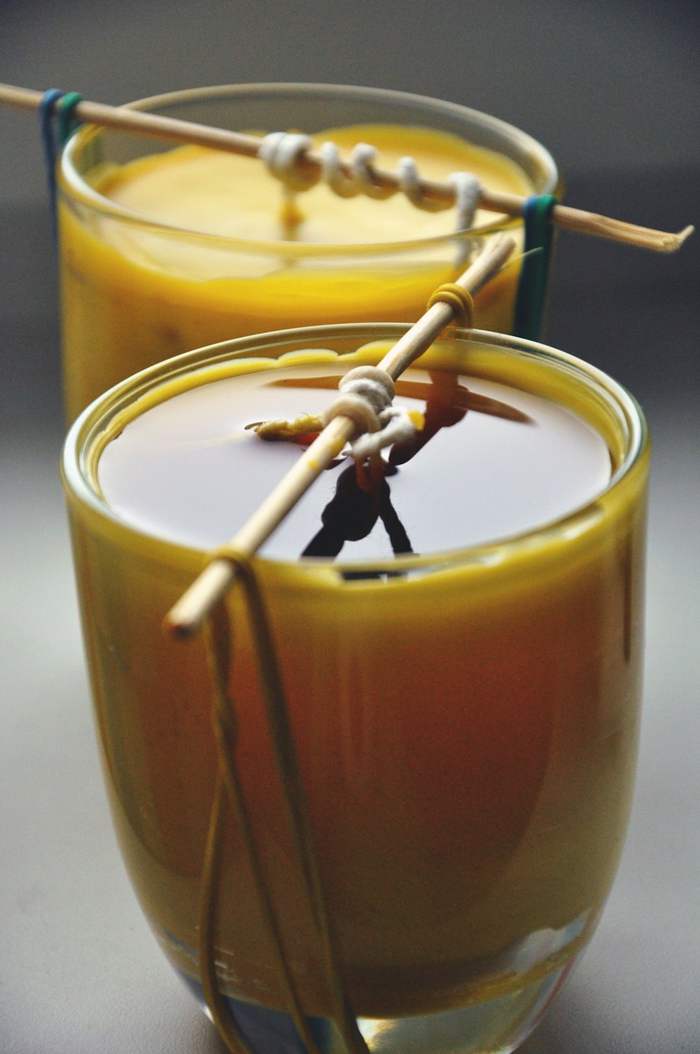 clear drinking glass with yellow liquid