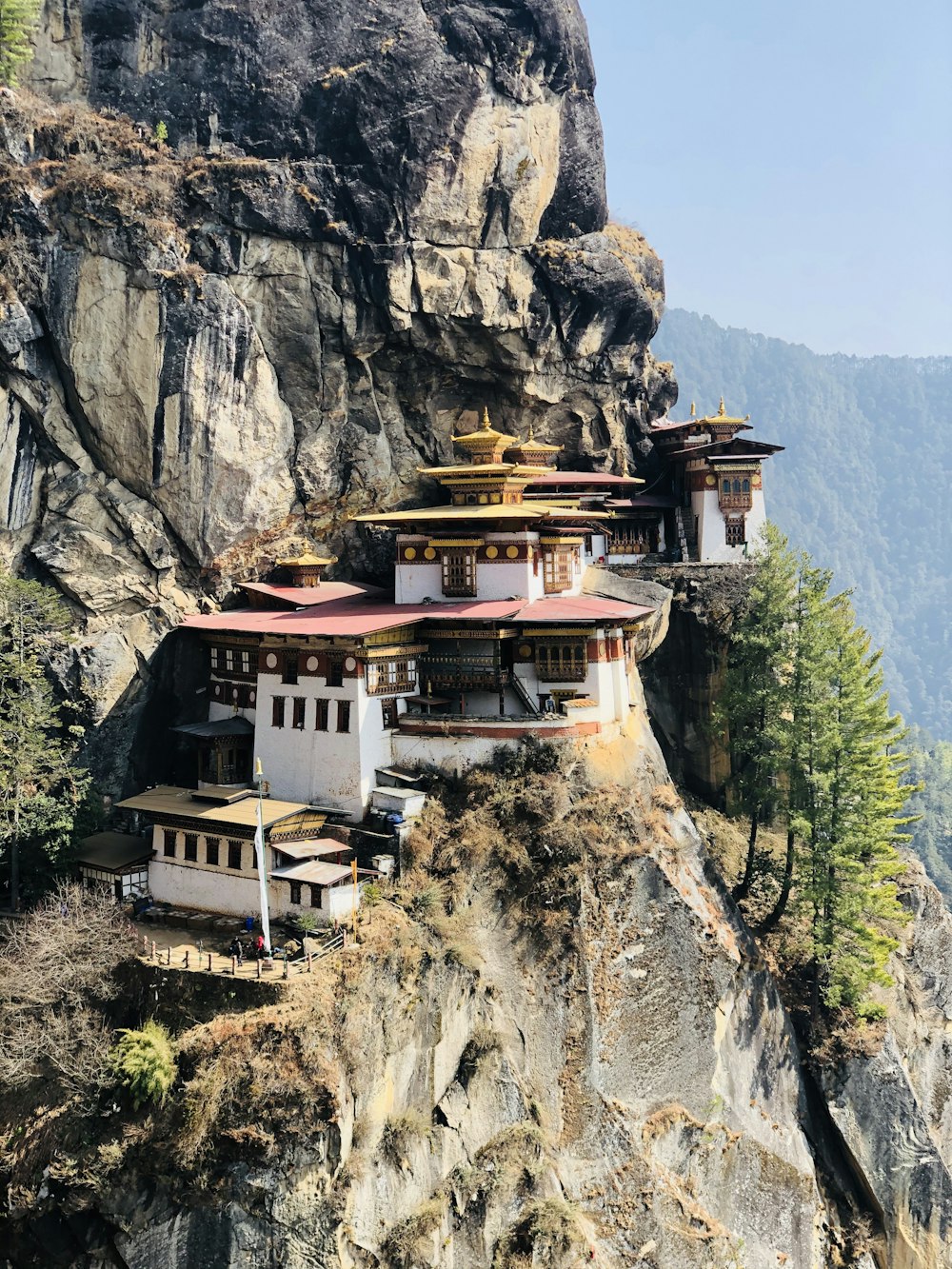 white and brown concrete house on mountain