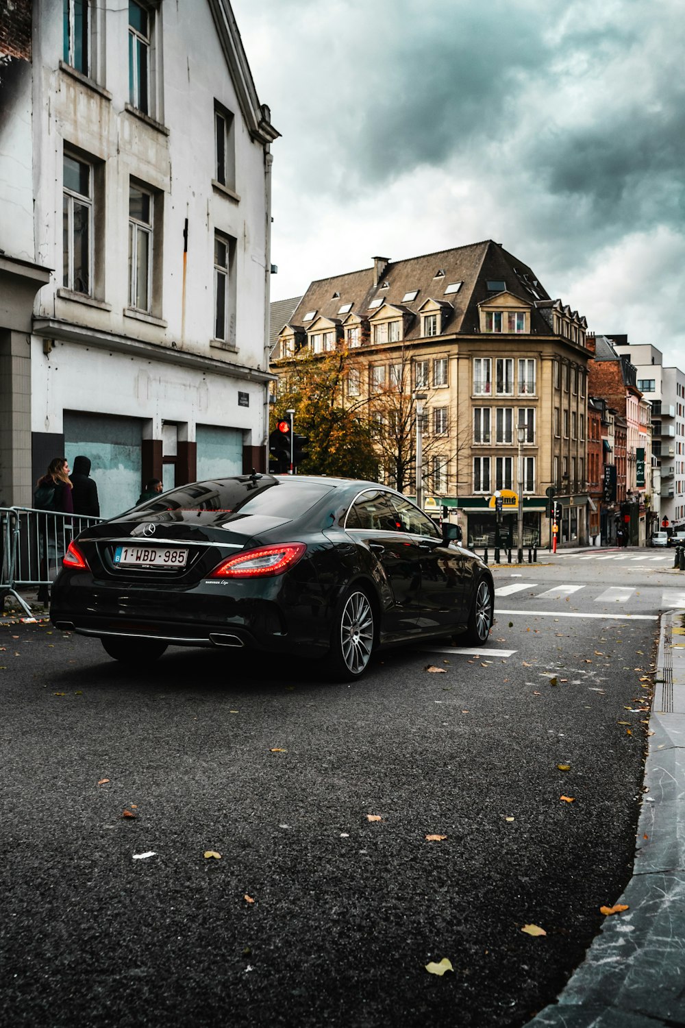 black bmw m 3 parked on sidewalk during daytime