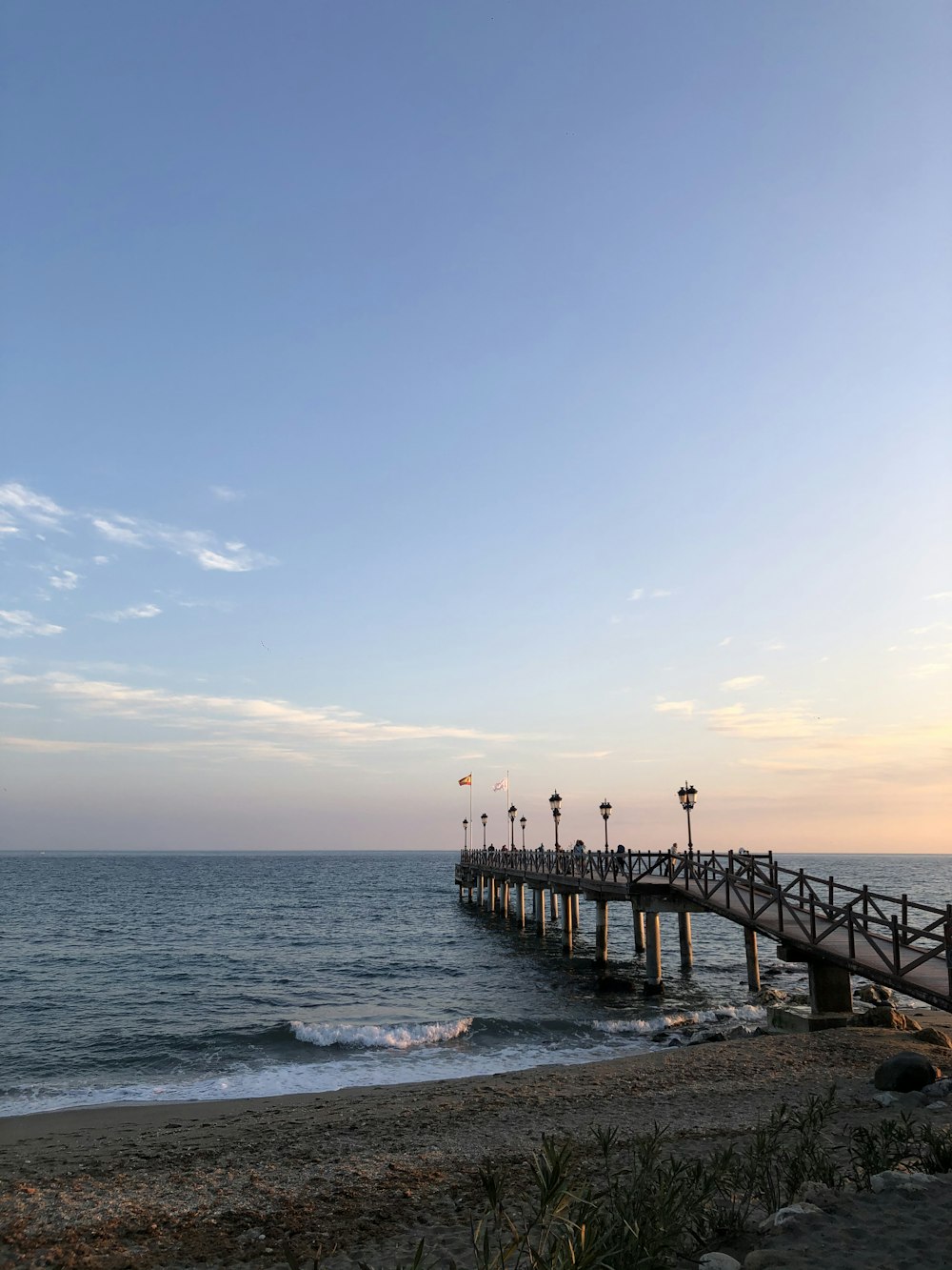 people standing on wooden dock during daytime