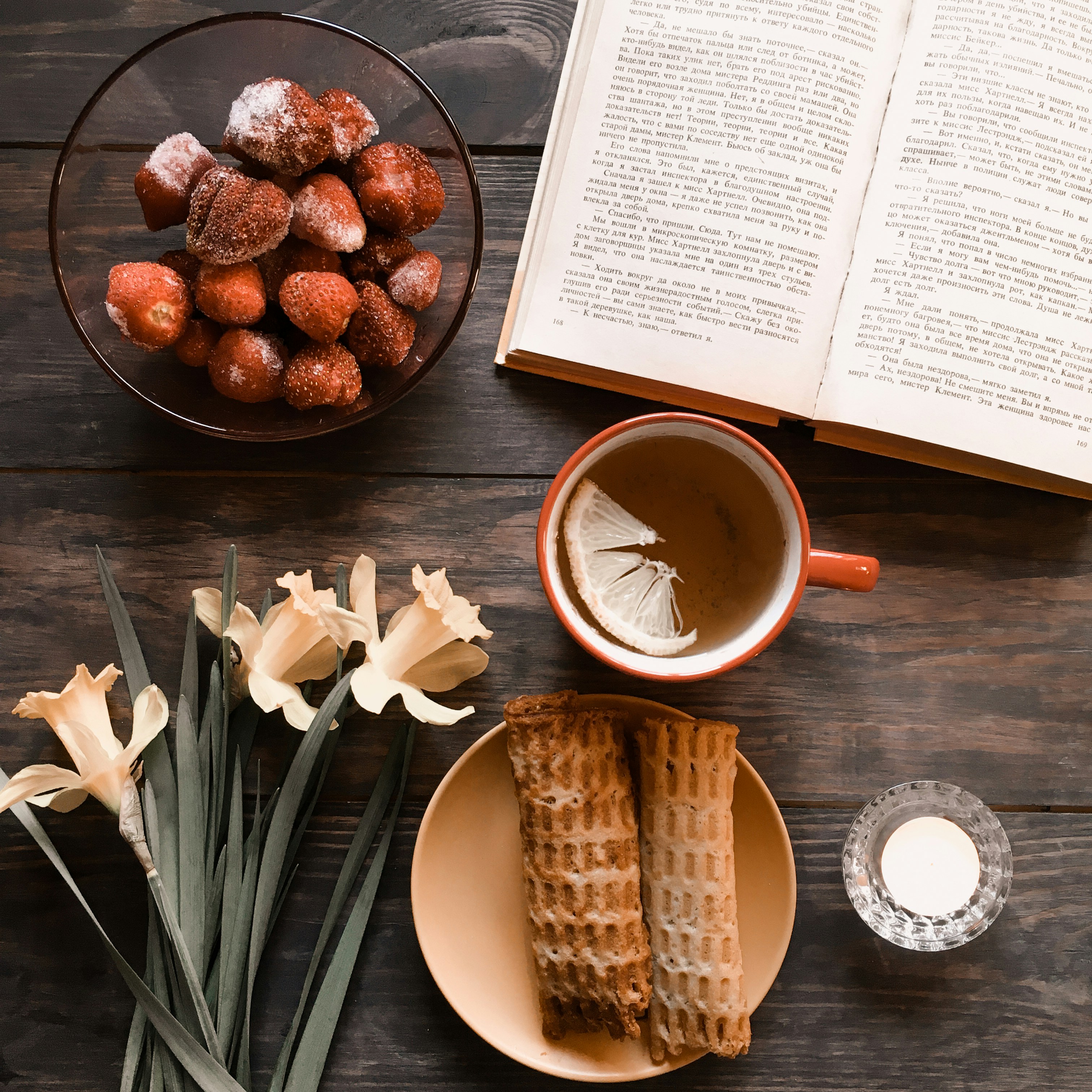 brown bread on blue ceramic plate beside white ceramic mug with coffee