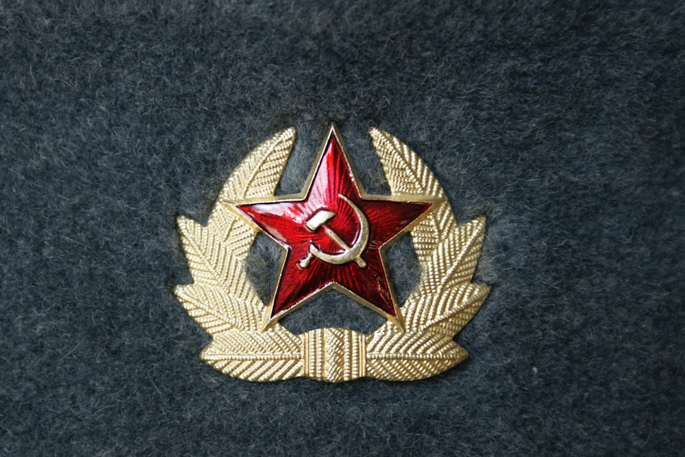 gold and red star patch