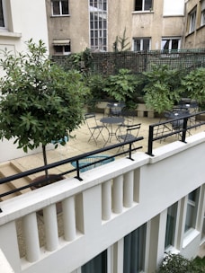 A vibrant outdoor patio with seating and plants.