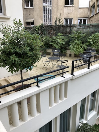 An inviting outdoor space with patio furniture and greenery.