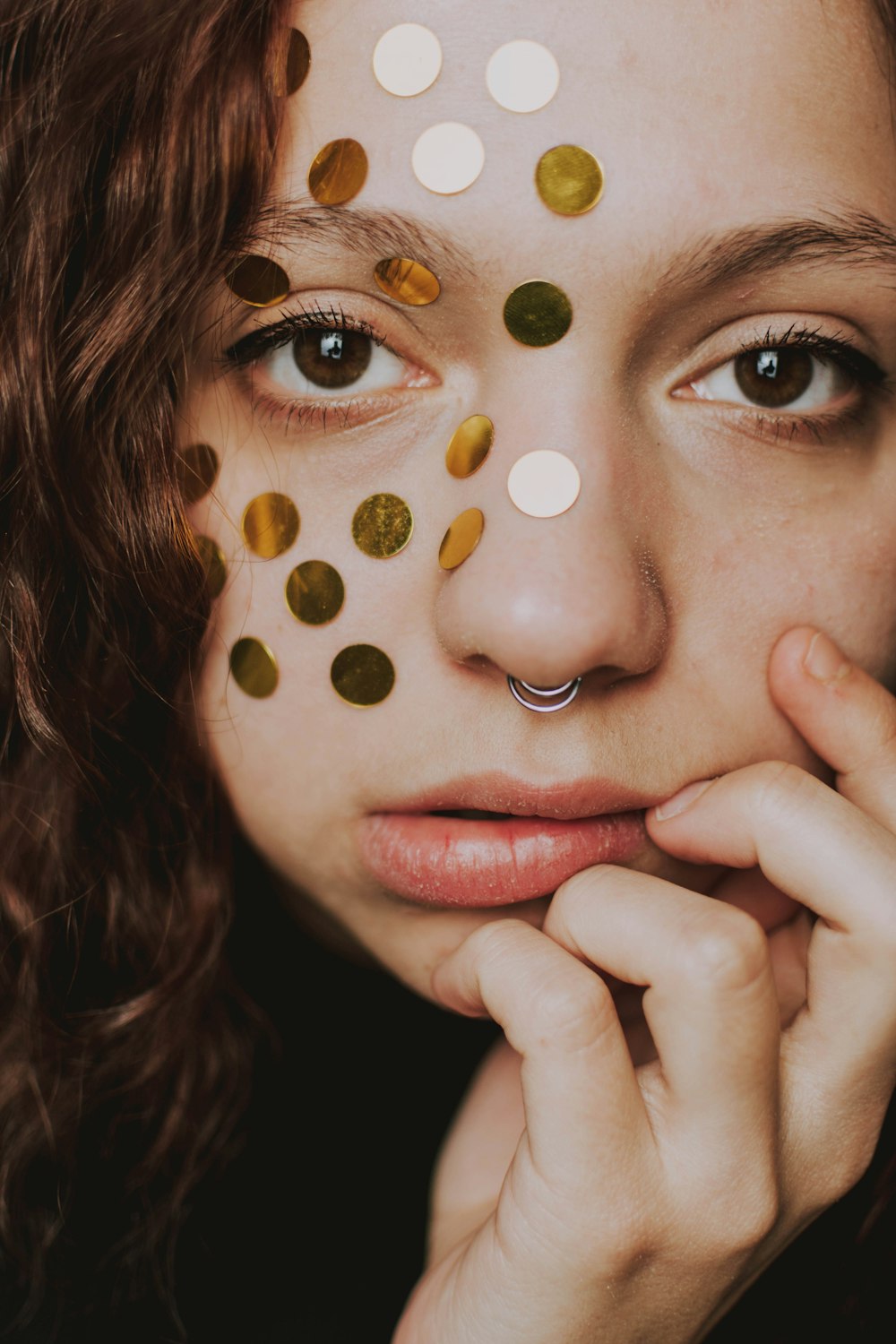 woman with silver and white glitter on her face