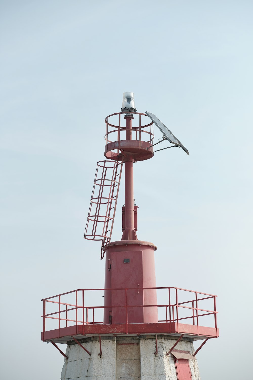 red and white tower under white sky