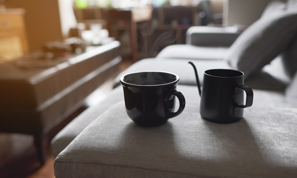 black ceramic mug on brown wooden table