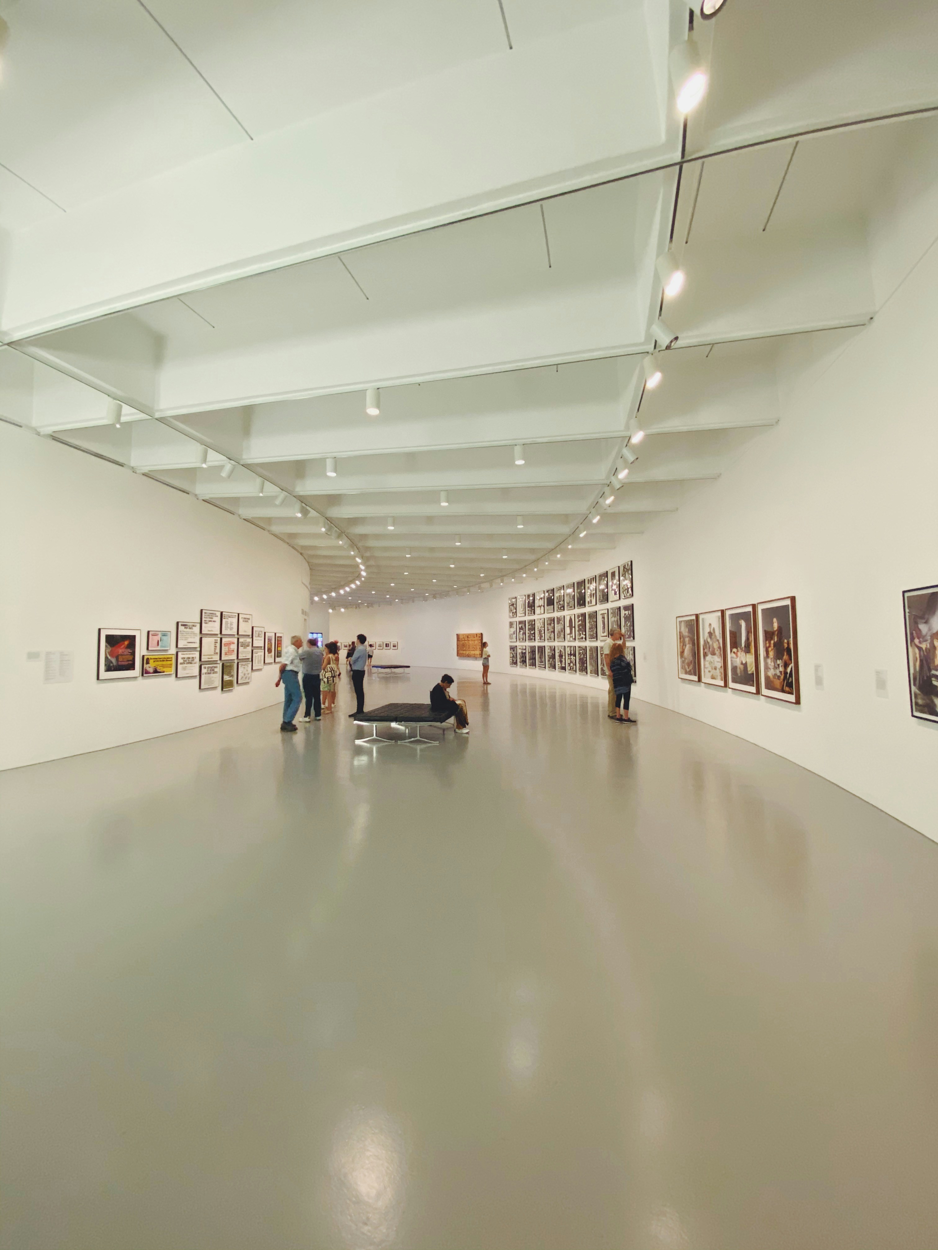 Gallery wall with various framed artworks and photos