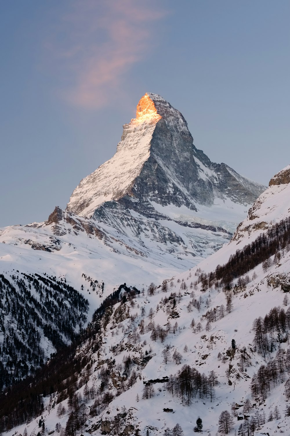 snow covered mountain under blue sky during daytime