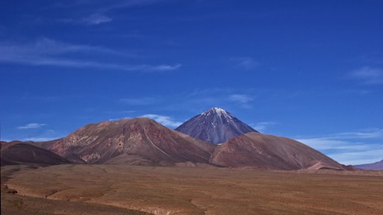 brown and gray mountain under blue sky during daytime in San Pedro de Atacama Chile