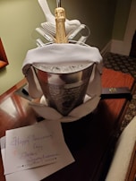 An elegant anniversary gift basket featuring gourmet treats and a handwritten note.