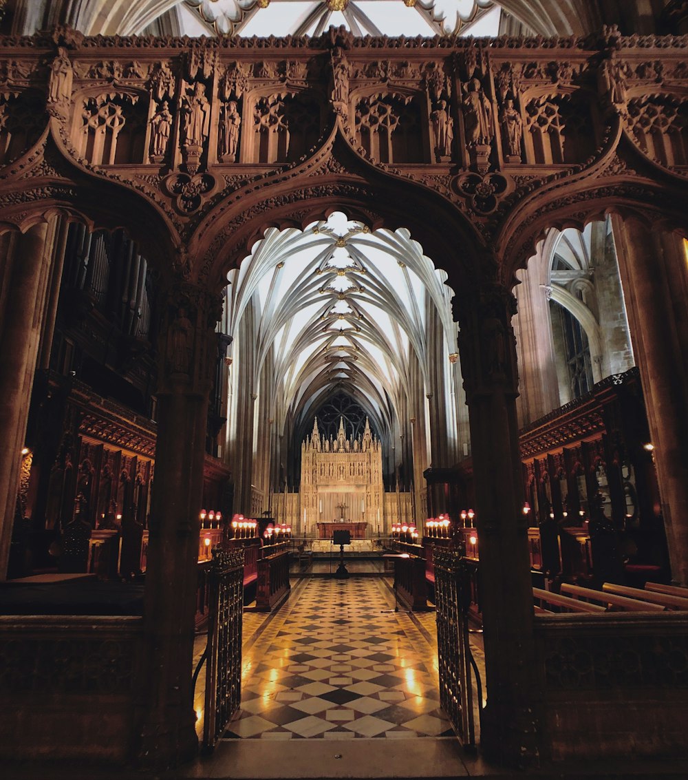 brown wooden bench inside cathedral