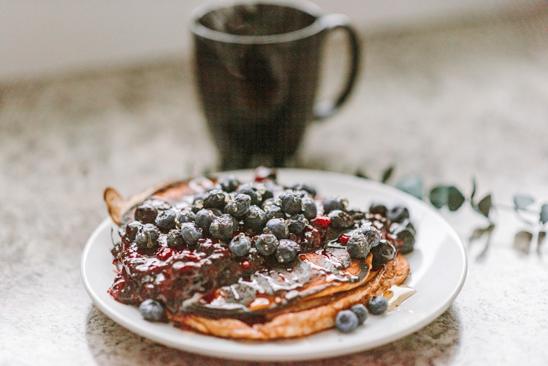 strawberry and blueberry on white ceramic plate