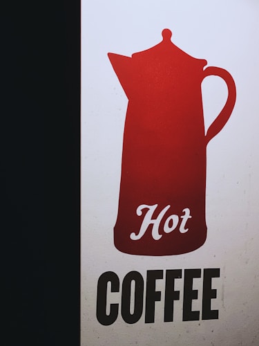A graphic design featuring a red silhouette of a coffee pot with the word 