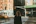woman in black coat standing on pedestrian lane during daytime