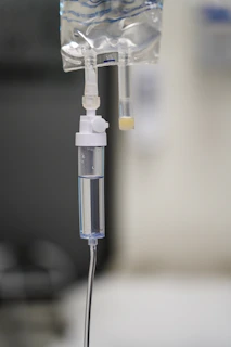 A wellness IV drip therapy session in progress, showing a relaxed patient receiving treatment.