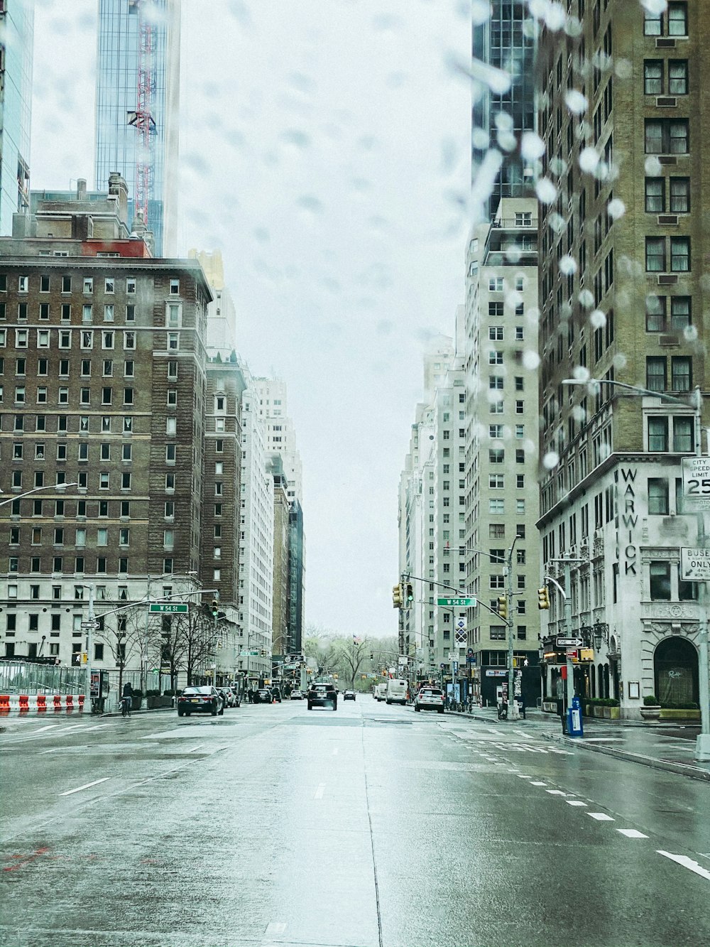 people walking on street near high rise buildings during daytime