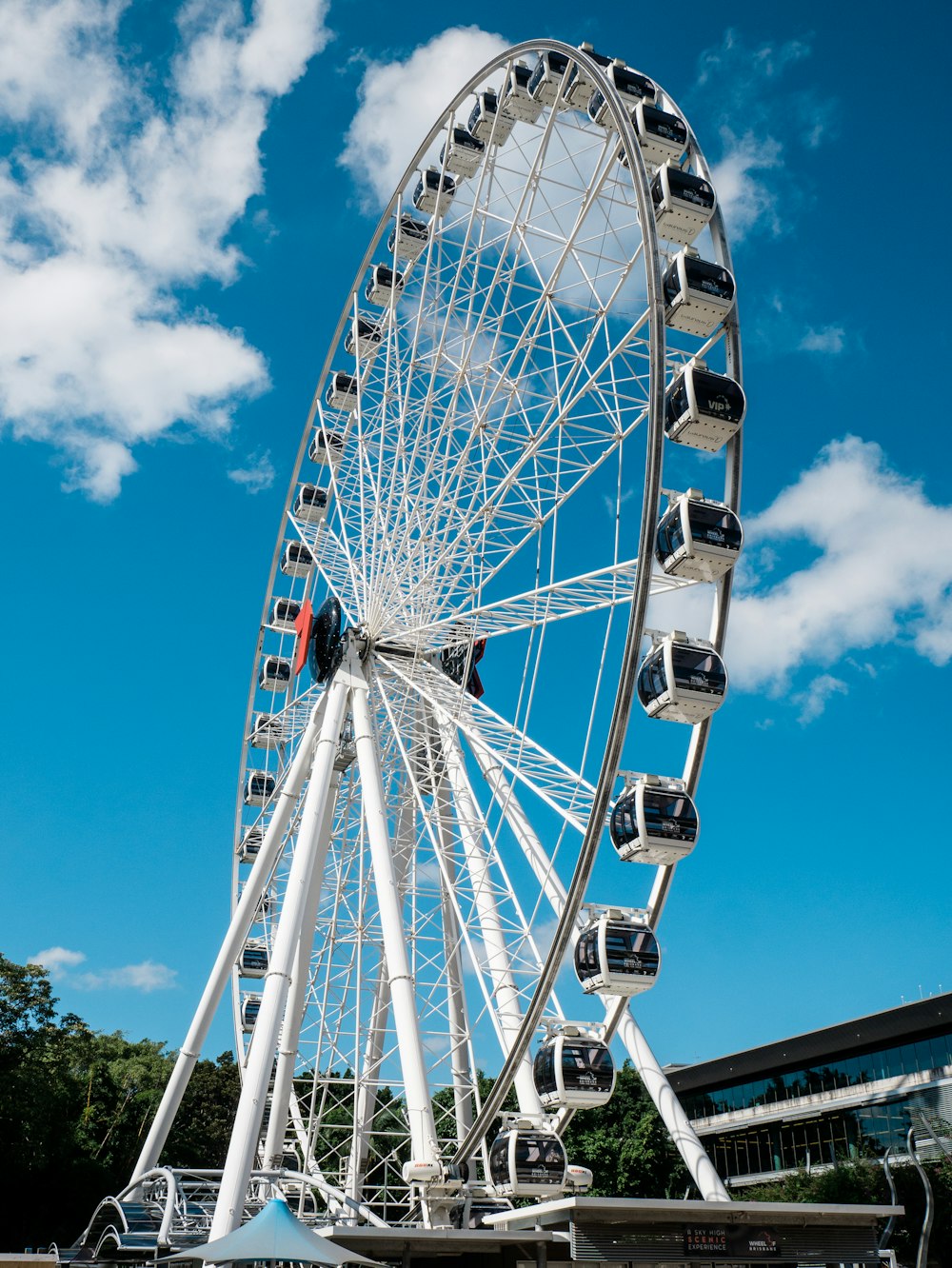 white ferris wheel under blue sky during daytime