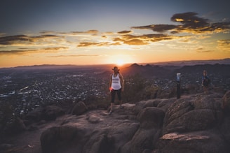 a group of people standing on top of a mountain