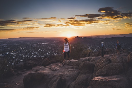 a group of people standing on top of a mountain